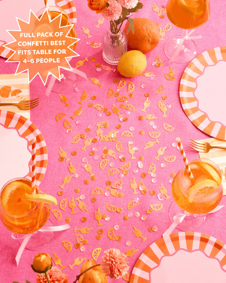 Spritz confetti down the center of a pink party table, a full pack fits a table for four to six