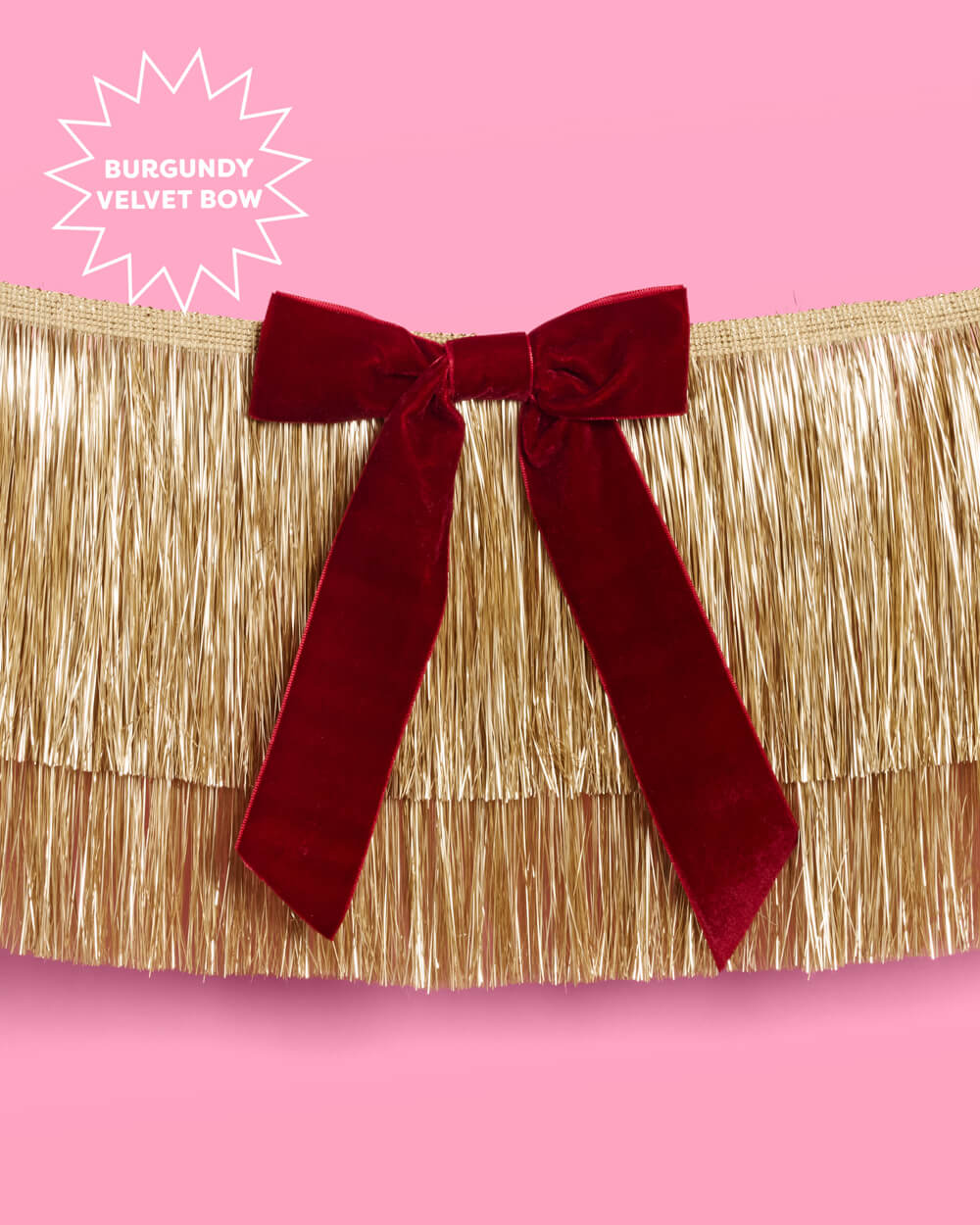 Gold Fringe Backdrop with Burgundy Velvet Bows