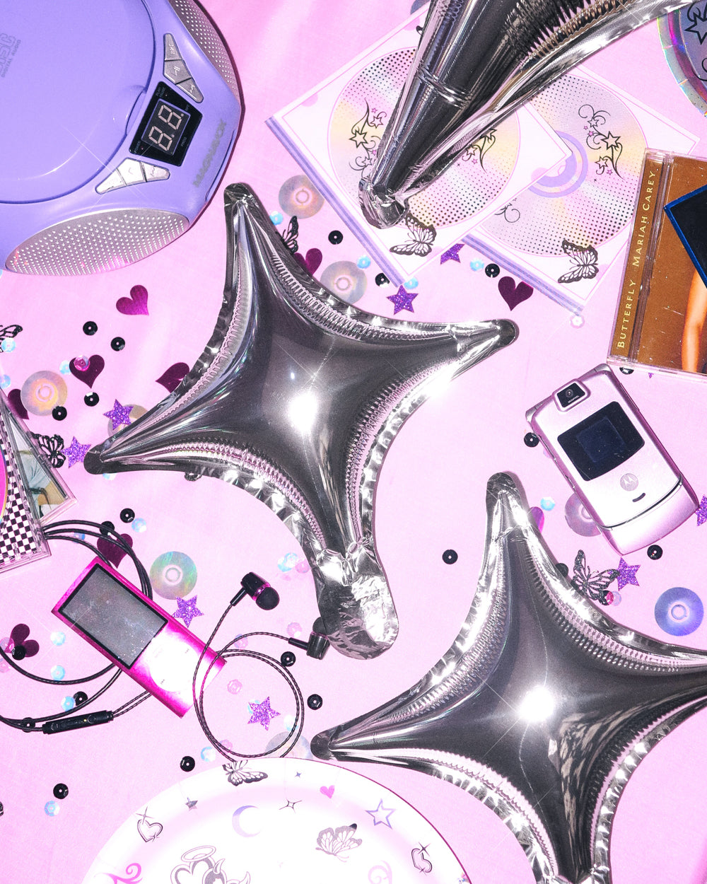 Silver sparkle foil balloons styled as a backdrop