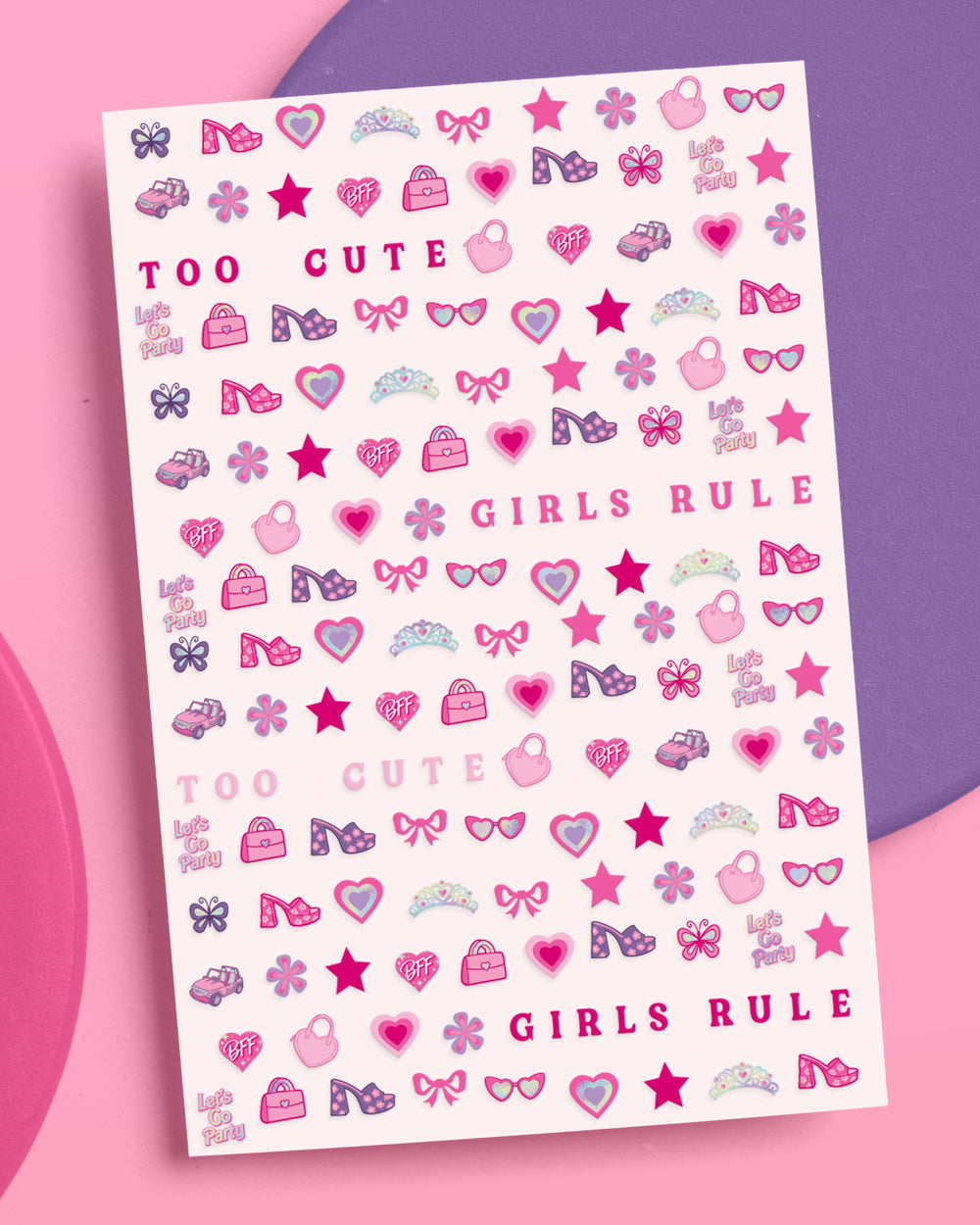 Pink nail sticker sheet with bows, hearts, tiaras, sunglasses, high heels, and GIRLS RULE lettering