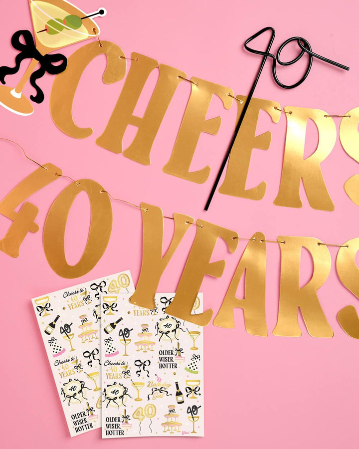 Cheers to 40 Years pink banner with cocktail glass accents