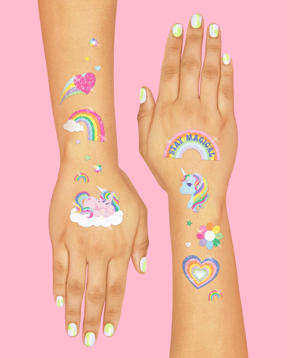 Arm and hand with glitter rainbow, heart, shooting star, and unicorn tattoos, a unicorn birthday party favor