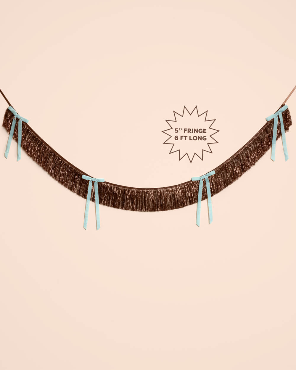Brown fringe bow banner shown flat with a starburst label reading 5 inch fringe, 6 feet long, for party backdrops