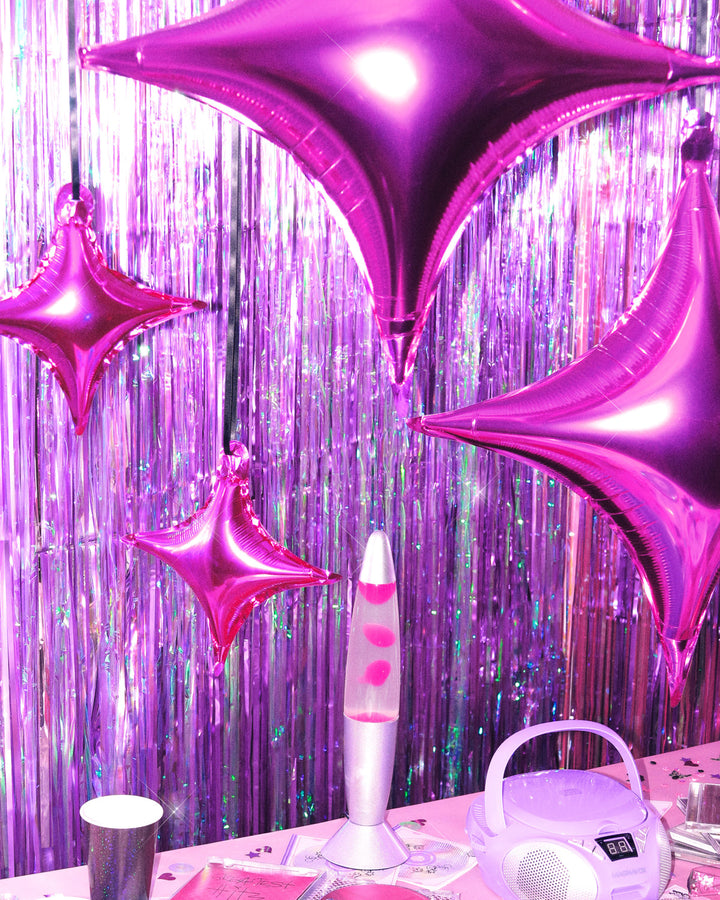 Pink and silver sparkle foil balloons styled at a party