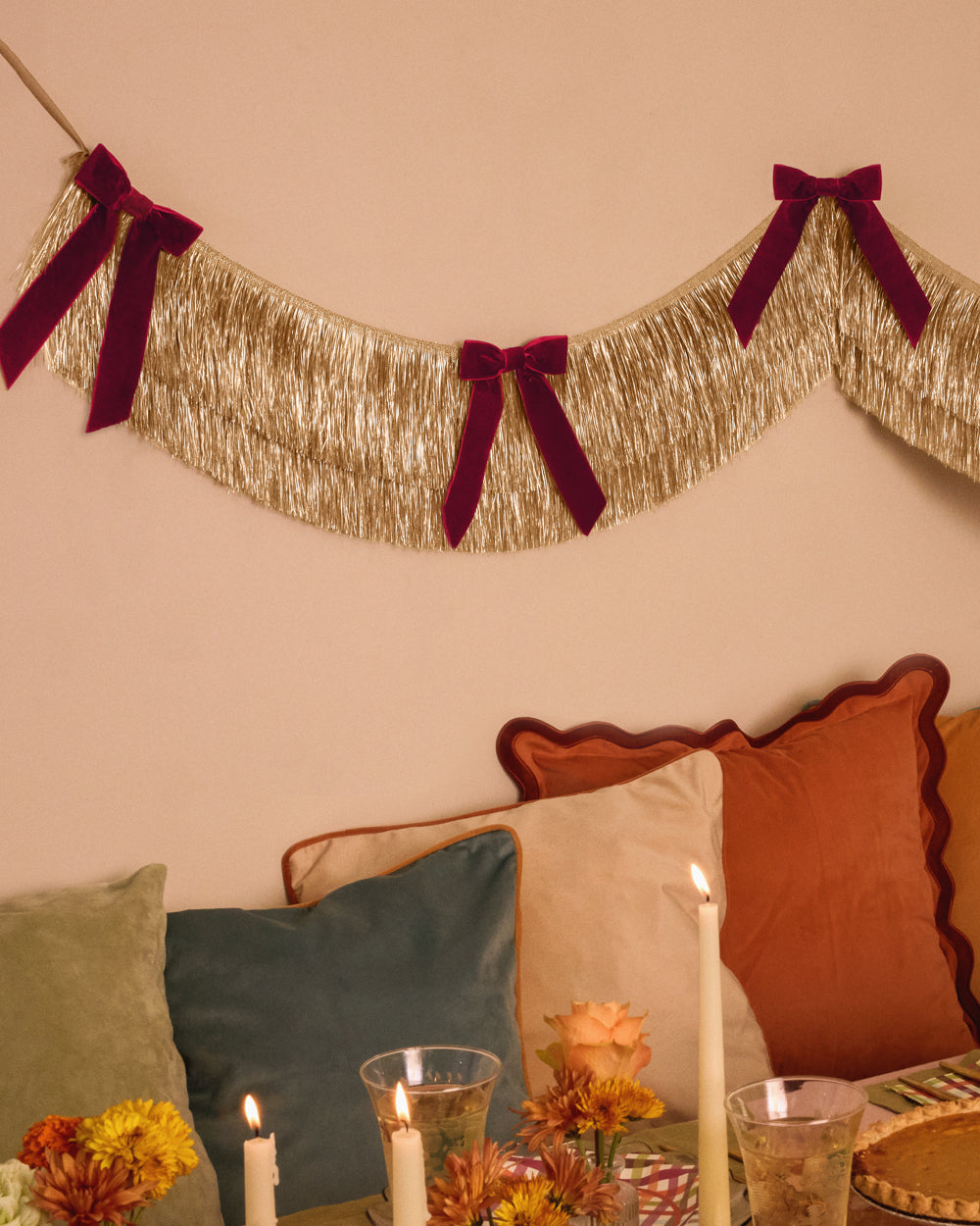 Gold Fringe Backdrop with Burgundy Velvet Bows