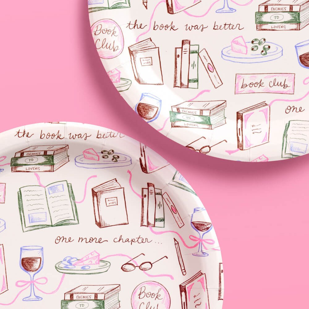 Book club paper plates in blush pink with hand-drawn books, wine glasses, and reading slogans like the book was better for a book club party
