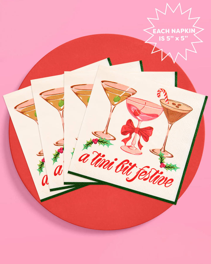 Cream martini cocktail napkins fanned on a red tray, with a callout noting each napkin is 5 x 5 inches