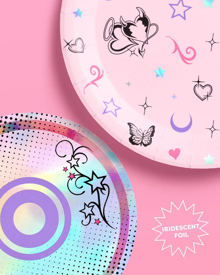 Pink Y2K dinner plate printed with butterflies, hearts, stars, and moons beside the foil dessert plate