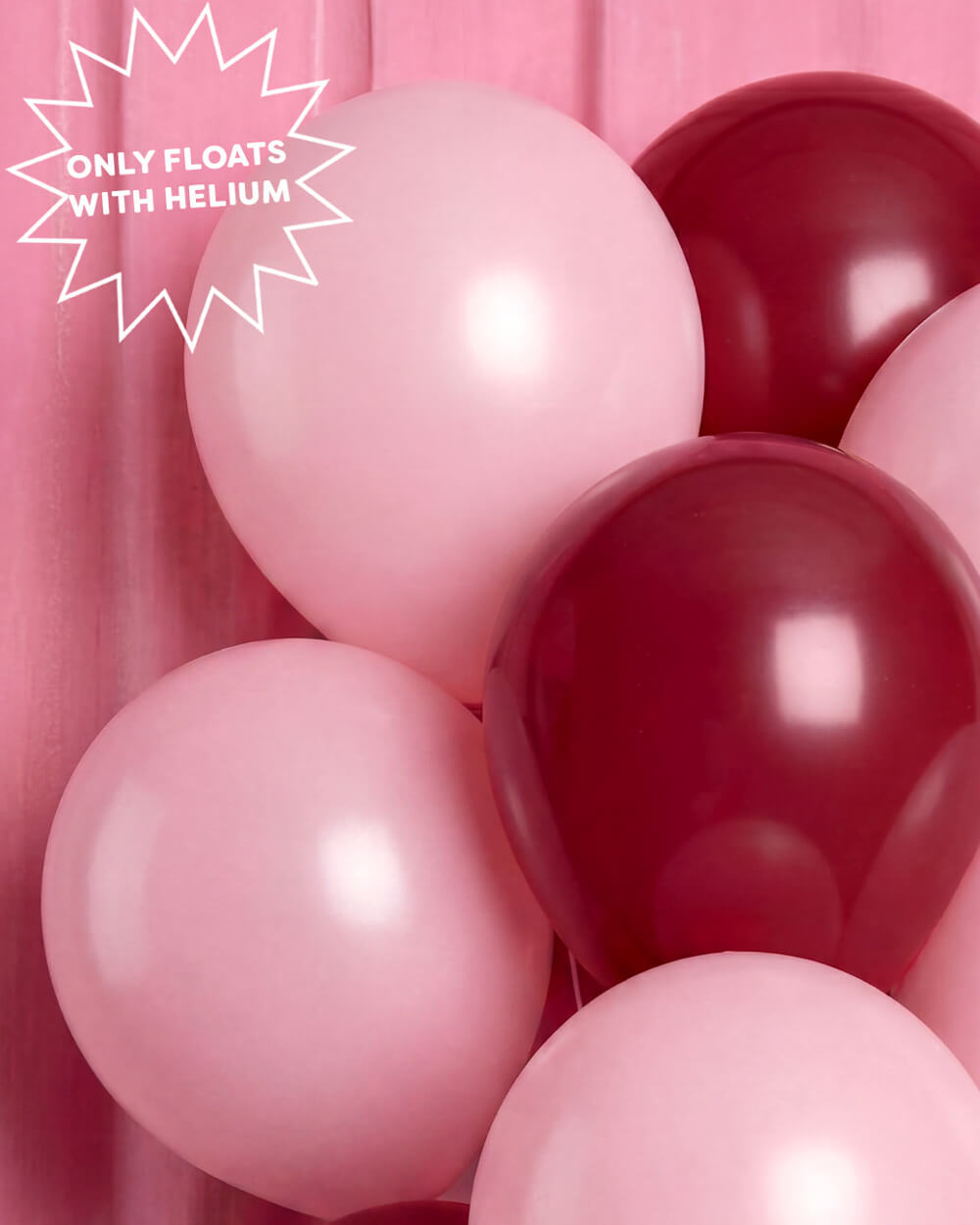 Burgundy and macaron pink latex balloons clustered together, float with helium
