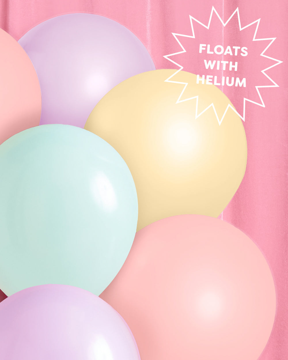 Pastel balloon garland styled at a party