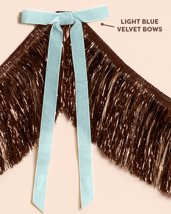 Close-up of the light blue velvet bows tied along the 6 foot brown metallic fringe banner, labeled light blue velvet bows