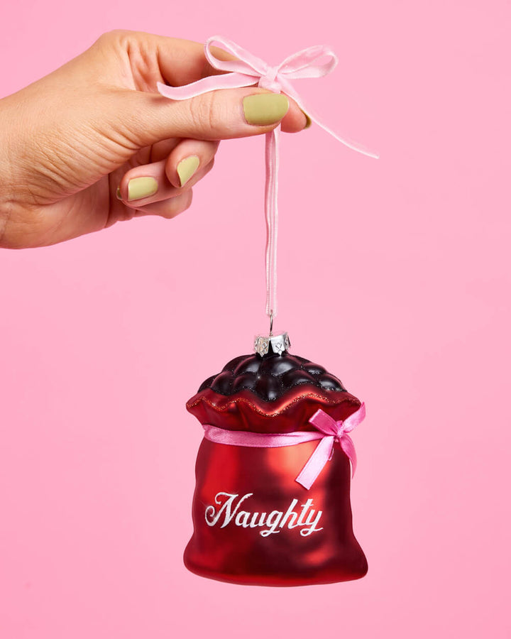 Additional product view of the two-piece Naughty and Nice glass Christmas ornament set.