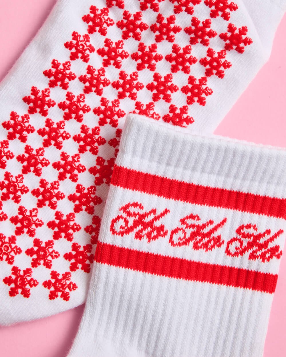 Close-up of the non-slip red snowflake grip dots on the sole of the Ho Ho Ho Christmas socks