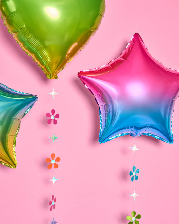 Rainbow balloons styled as a party backdrop