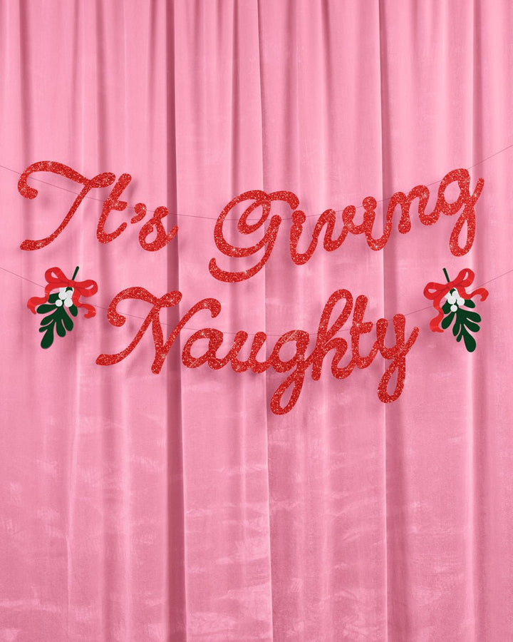 It's Giving Naughty Christmas banner in red glitter with green holly and red berry accents