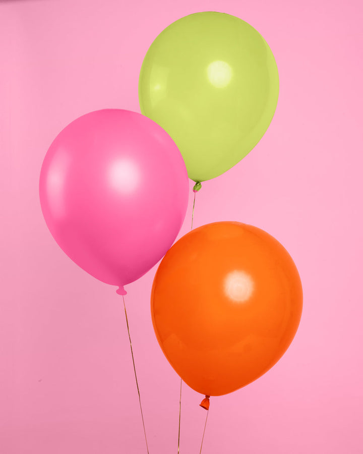 Tropical balloons styled as a party backdrop