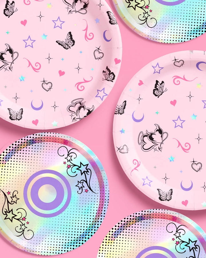 Pink butterfly dinner plates and iridescent CD dessert plates overlapping on a pink table