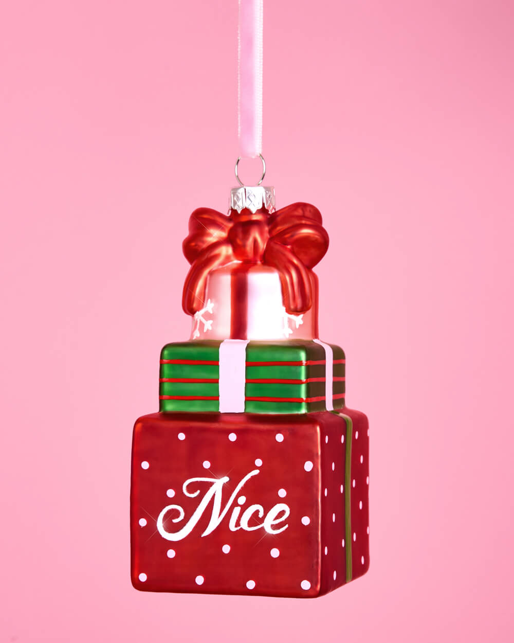 Additional product view of the Naughty and Nice ornaments, a red coal sack and a Nice gift box stack.