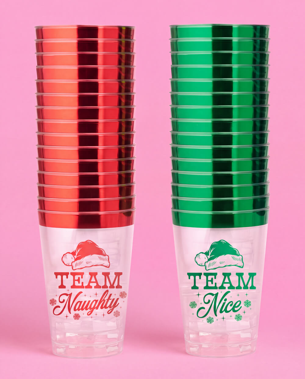 Two stacks of plastic Christmas cups, red-rimmed Team Naughty and green-rimmed Team Nice