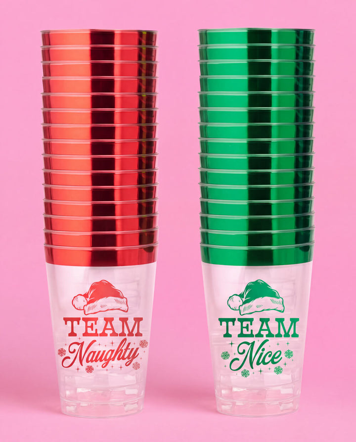 Two stacks of plastic Christmas cups, red-rimmed Team Naughty and green-rimmed Team Nice
