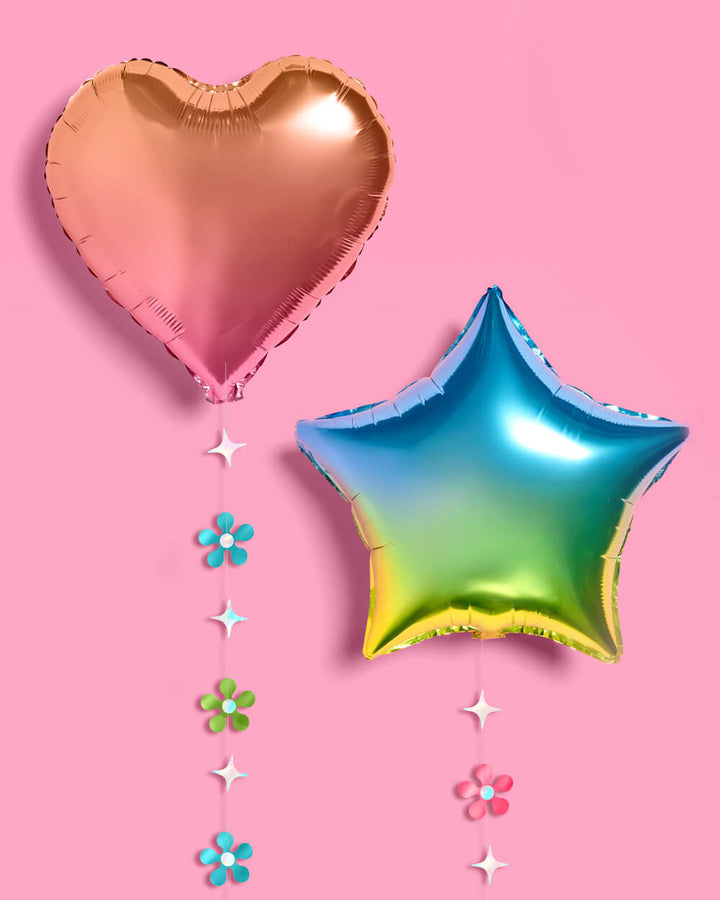 Rainbow balloons with flower garland strands