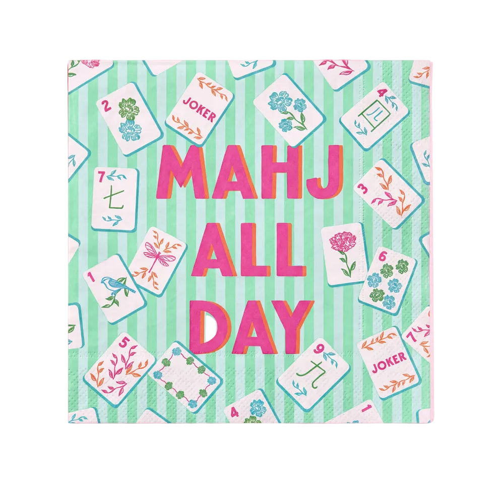 A square paper napkin with a pastel green and white striped background, scattered illustrated playing cards, and large pink text reading 'MAHJ ALL DAY' on a solid pink background.
