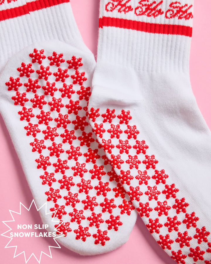 Detail of the red snowflake grips covering the full sole of the Christmas pilates socks