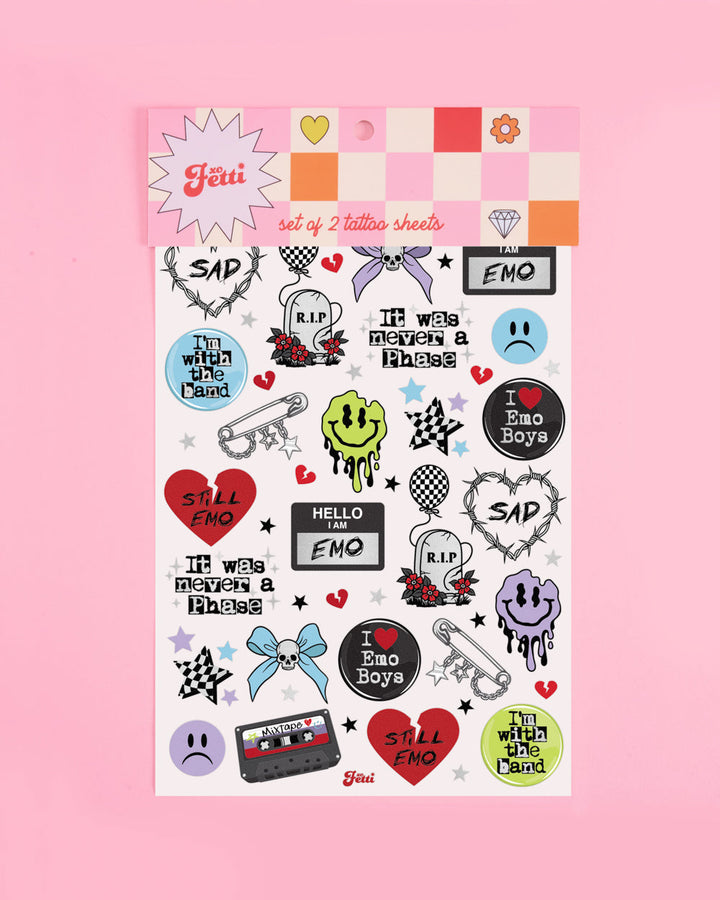 Emo temporary tattoos sheet in retail packaging on a pink background