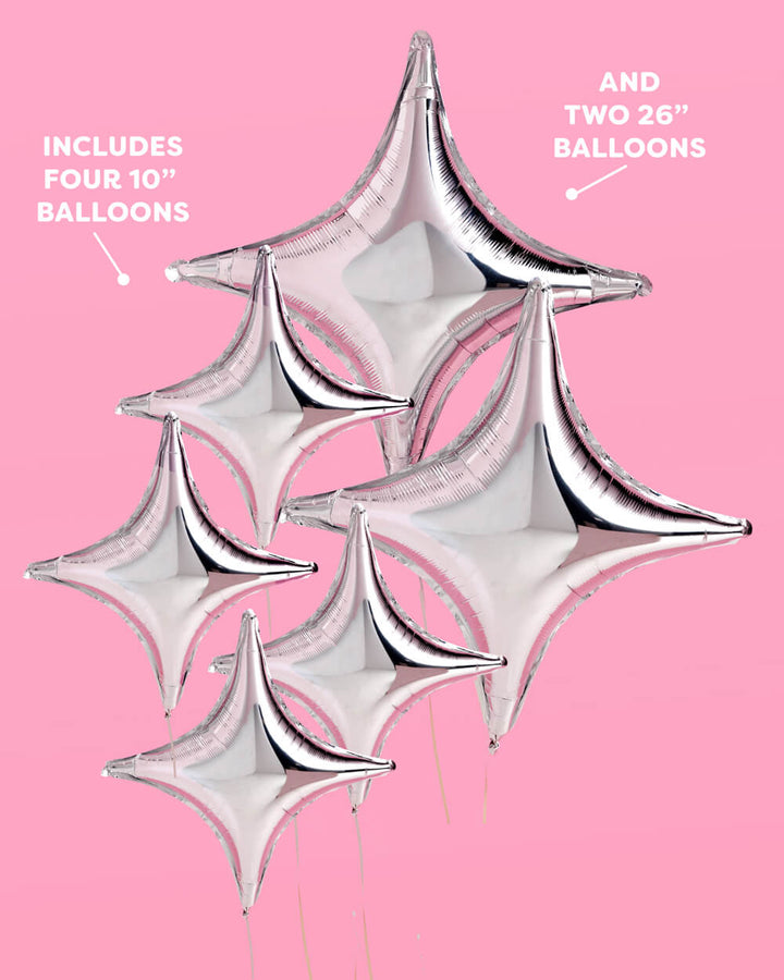 Silver sparkle foil balloons styled at a party