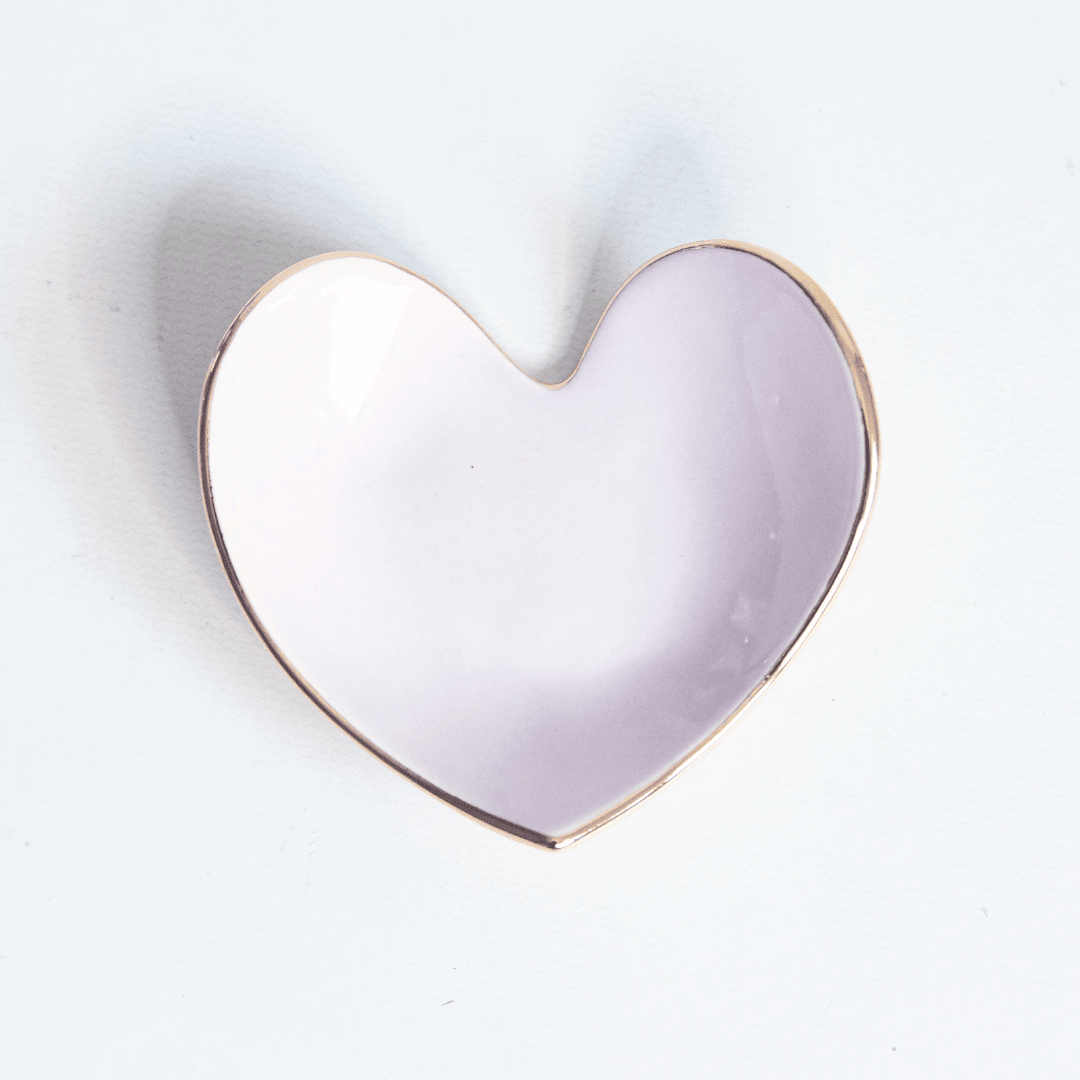 Pale lilac heart ring dish with a gold rim, top view