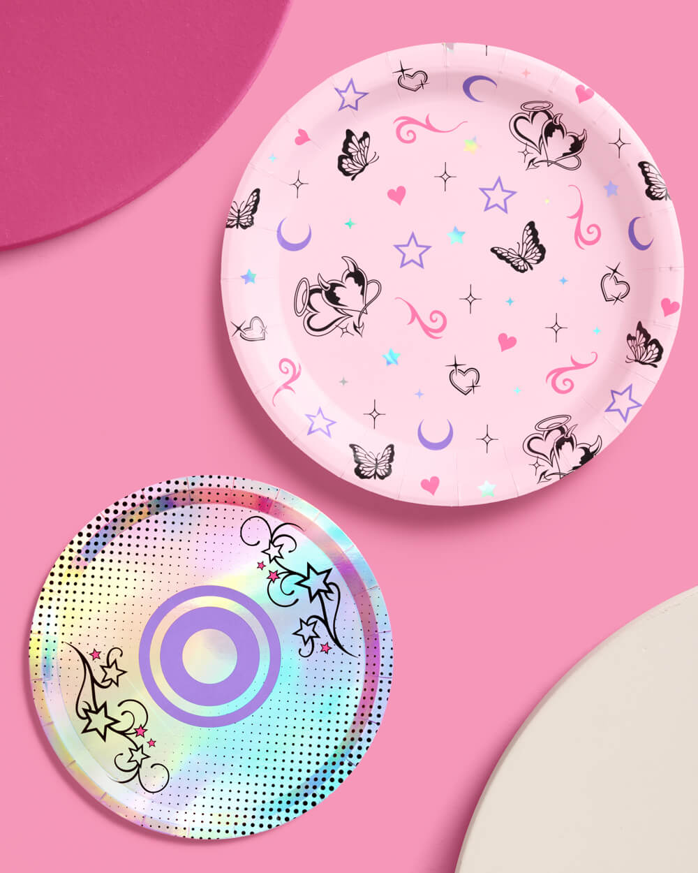 One pink butterfly dinner plate and one iridescent CD dessert plate from the Y2K set on pink