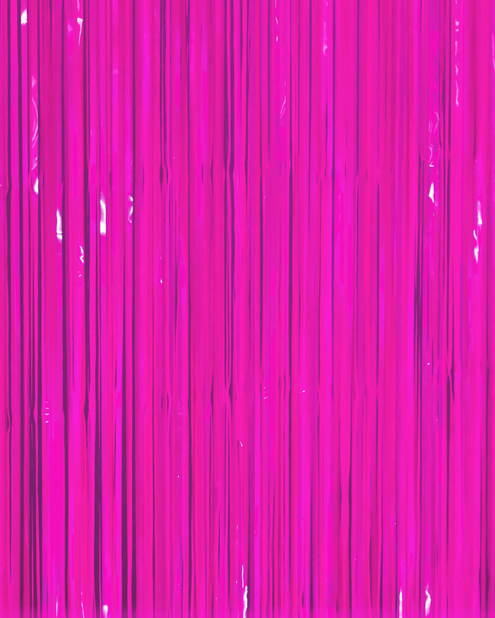 Neon magenta fringe curtain strands hung full width as a glow party backdrop
