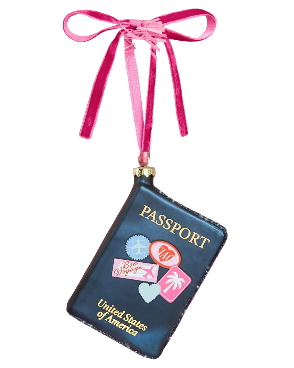Navy passport-shaped glass Christmas ornament covered in colorful travel stickers, hanging from a bright pink ribbon.