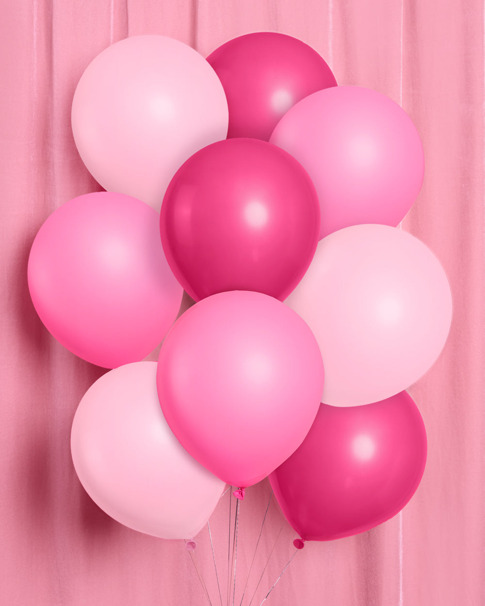 Pink latex balloons styled together in three shades
