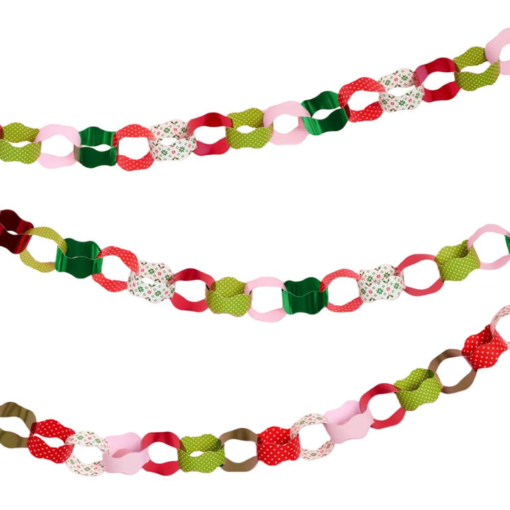 Assembled Christmas paper chain garland strands in red, green, pink, and cream
