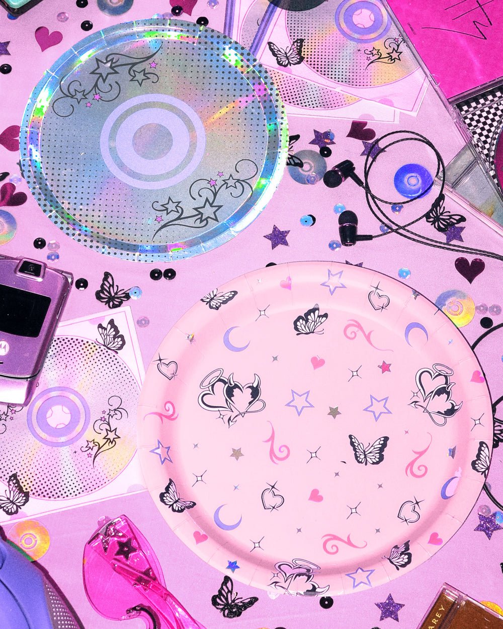 Iridescent CD dessert plate and pink butterfly dinner plate from the Y2K party plates set