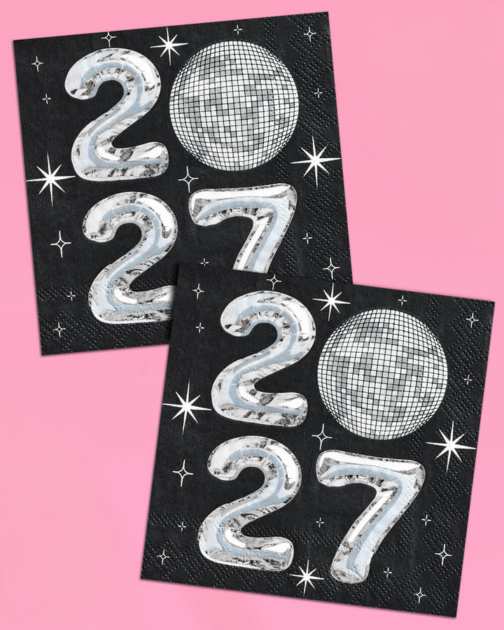 Black 2027 New Year's Eve napkins with silver foil numerals and a disco ball