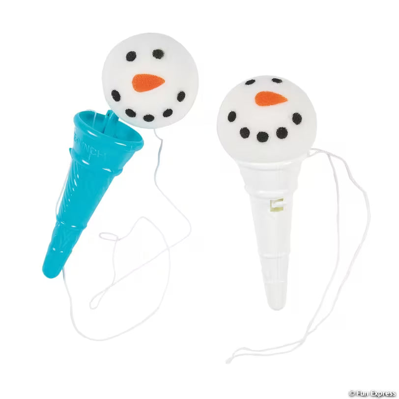 Teal and white cone shooter toys with soft snowman face balls on strings, one ball launched, a winter party favor