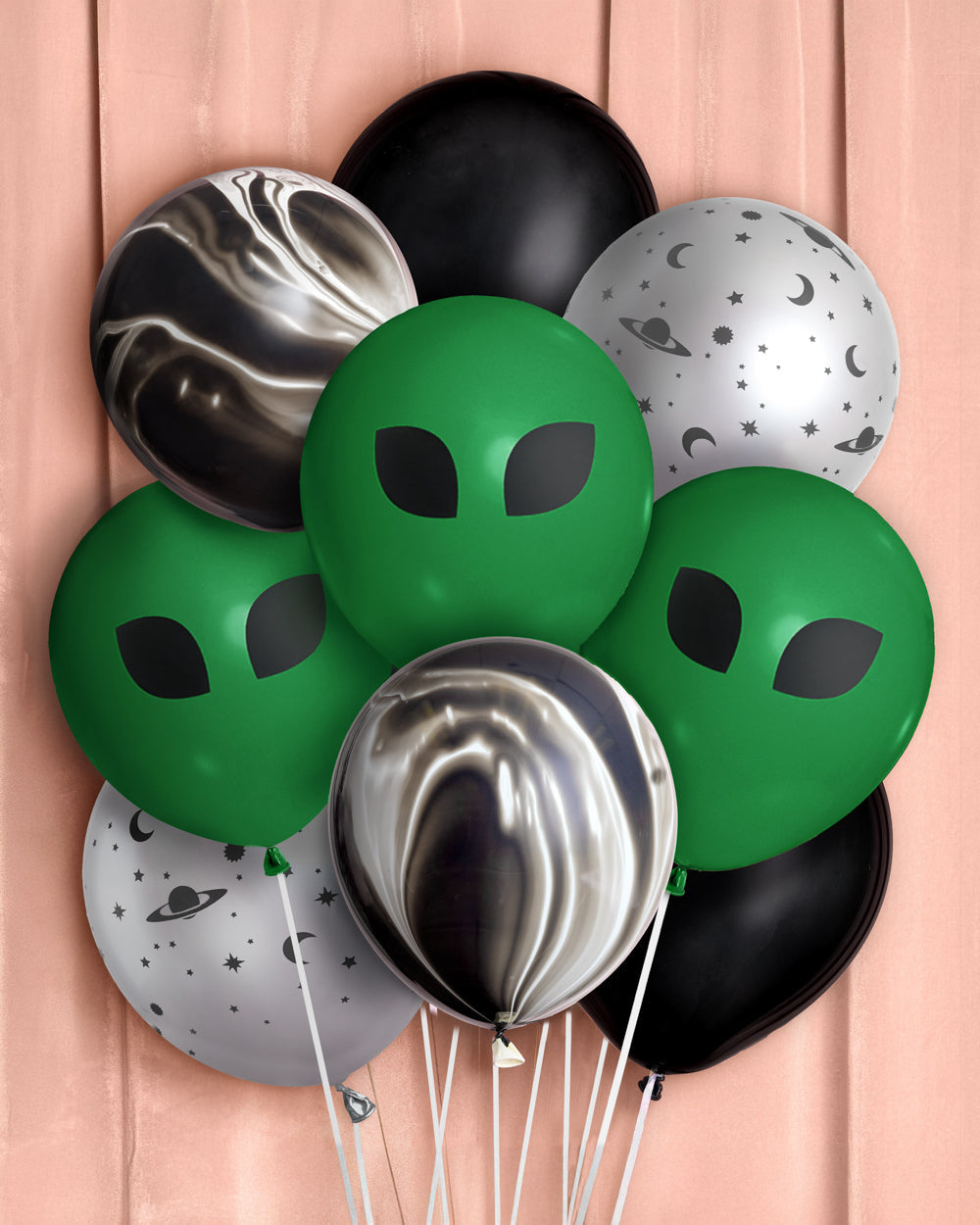 Bunch of space and alien latex balloons: green alien faces, black, silver star print, and black marble