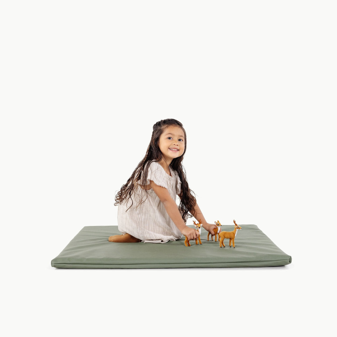 Baby on the Gathre padded play mat during tummy time.