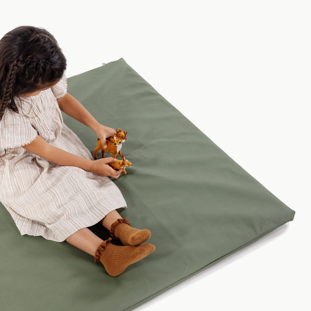 Gathre padded baby play mat in soft neutral vegan leather.