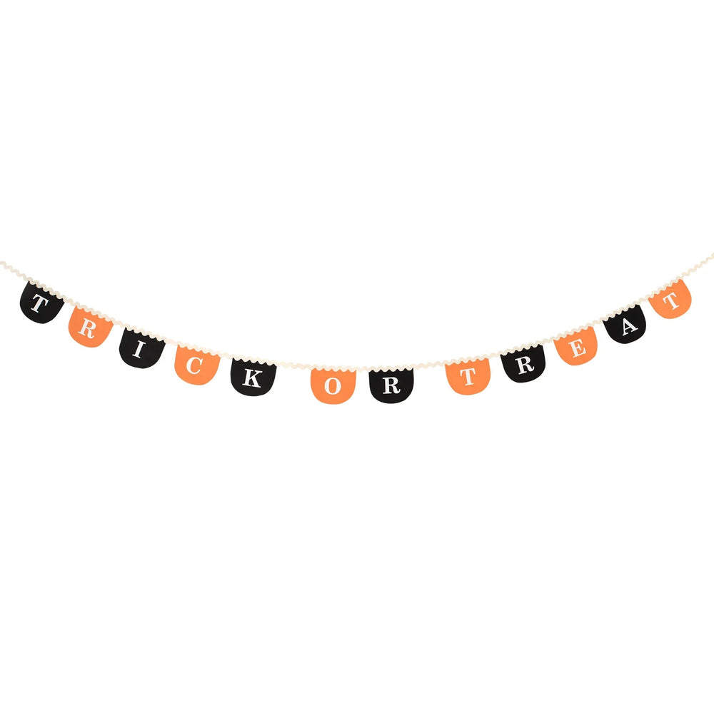 Meri Meri Trick or Treat fabric garland on white background with orange and black Halloween lettering