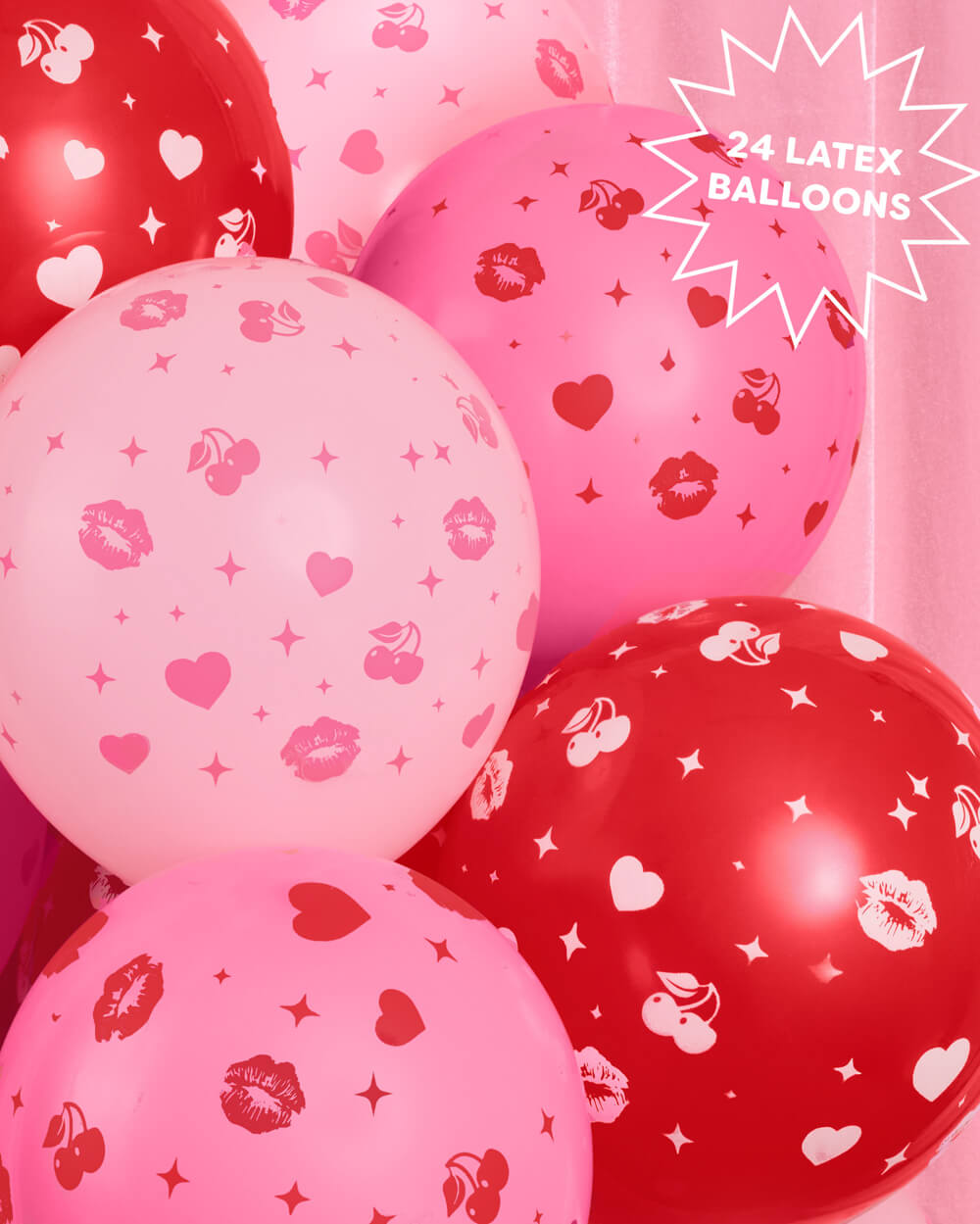 Close-up of pink latex balloons with all-over kiss prints