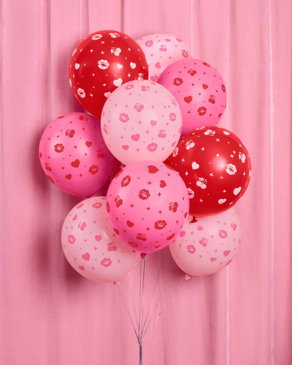 Bunch of Valentine's Day latex balloons in red, pink, and light pink with kisses and hearts