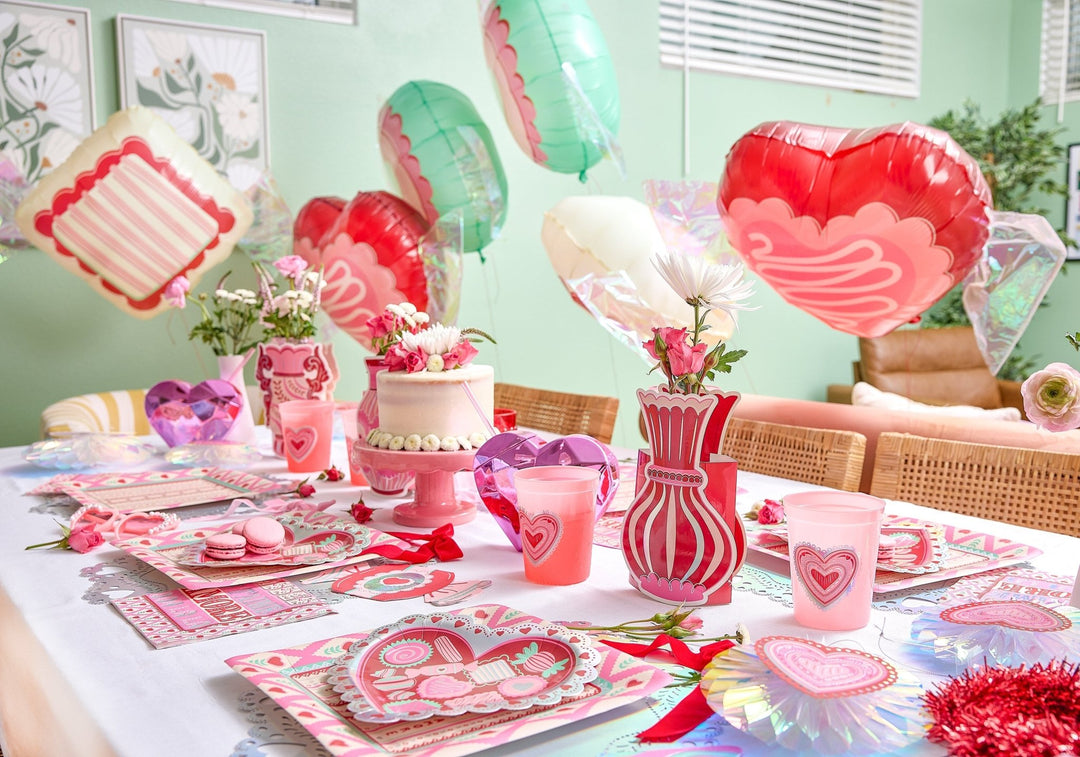 Six Valentine candy shaped balloons in heart, circle, and square with silver iridescent foil