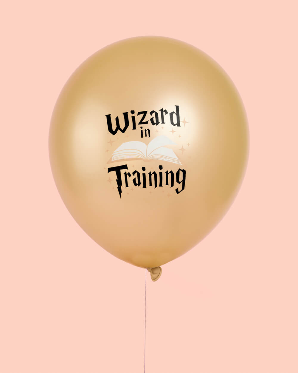 Bunch of black, white, and gold wizard latex balloons