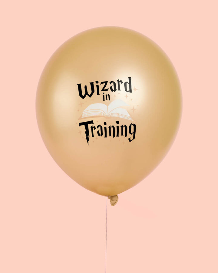 Bunch of black, white, and gold wizard latex balloons