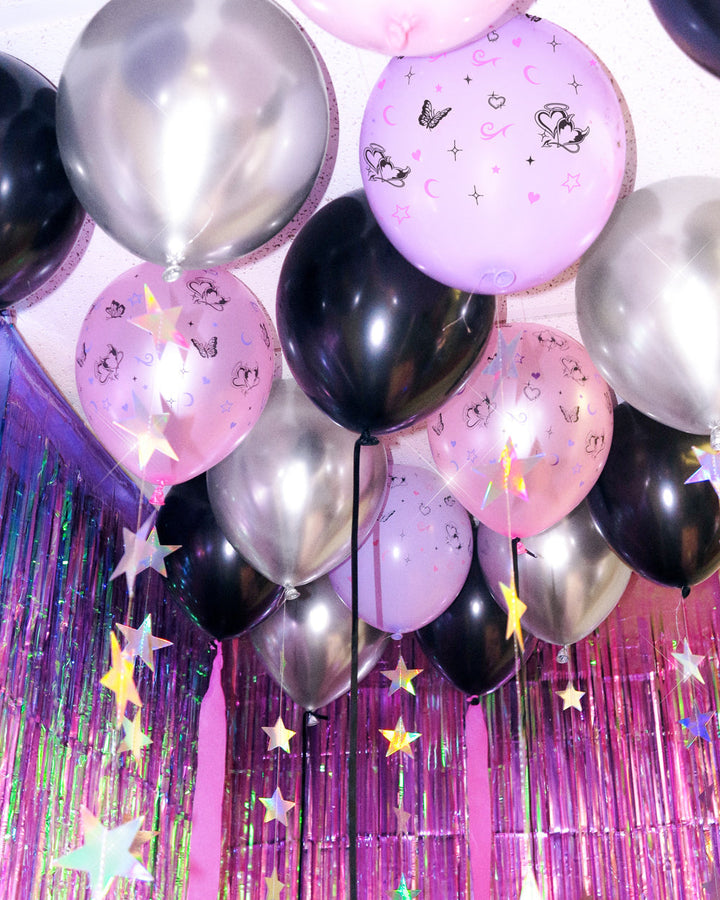 Bunch of Y2K latex balloons in pink, lavender, black, and silver chrome with butterfly prints
