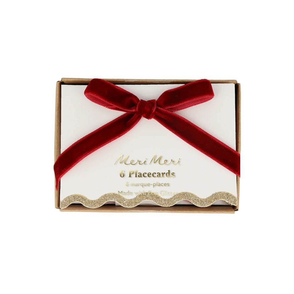 Meri Meri velvet bow place cards on white background, assorted colorful velvet bows for holiday table settings